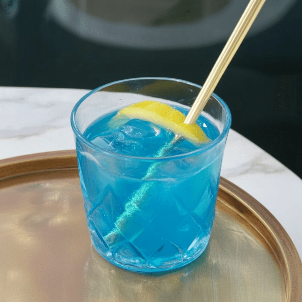 Blue Salt Trick – Blue salt crystals in a small dish beside a glass jar of infused water.